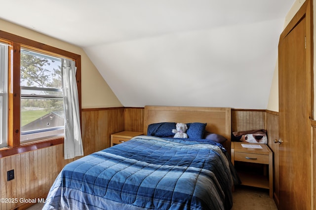 116 Medbury Rd, Greenfield, NY 12859 - bedroom featuring wooden walls, lofted ceiling, and a wainscoted wall