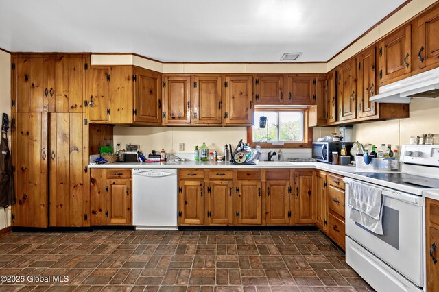 116 Medbury Rd, Greenfield, NY 12859 - kitchen featuring white appliances, light countertops, brown cabinets, and brick patterned floors