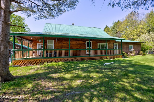 116 Medbury Rd, Greenfield, NY 12859 - rear view of property with a porch, a yard, and metal roof