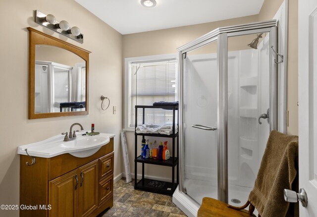 116 Medbury Rd, Greenfield, NY 12859 - bathroom with a stall shower, vanity, and stone finish flooring