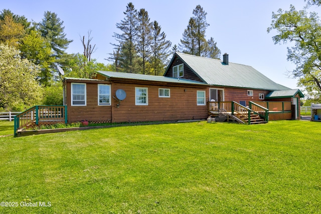 116 Medbury Rd, Greenfield, NY 12859 - rear view of property with a lawn, faux log siding, a chimney, and metal roof
