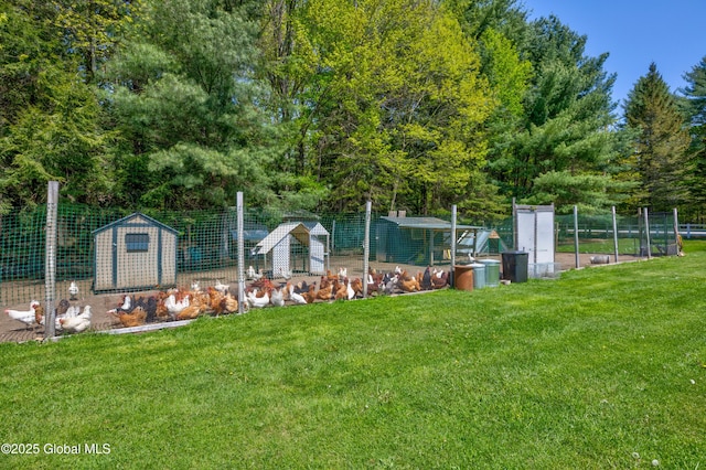 116 Medbury Rd, Greenfield, NY 12859 - view of grassy yard featuring exterior structure and an outbuilding