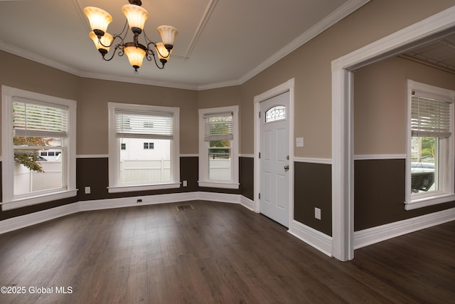 185 Bay St, Glens Falls, NY 12801 - unfurnished dining area with a chandelier, dark wood finished floors, baseboards, and ornamental molding