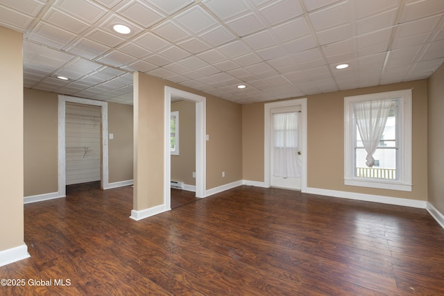 185 Bay St, Glens Falls, NY 12801 - empty room with baseboards, dark wood-style flooring, recessed lighting, and a baseboard radiator