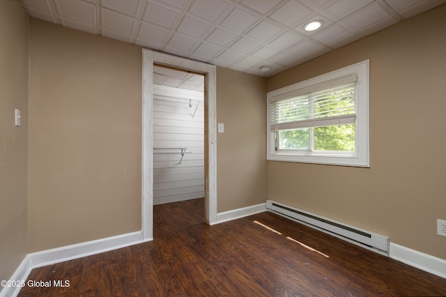 185 Bay St, Glens Falls, NY 12801 - empty room with a baseboard radiator, baseboards, dark wood-style floors, and recessed lighting