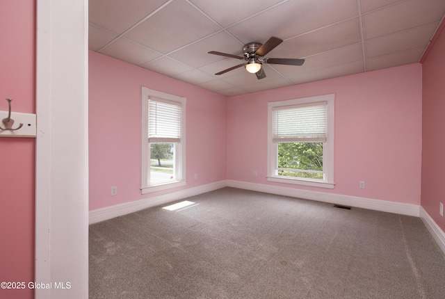 185 Bay St, Glens Falls, NY 12801 - carpeted spare room featuring plenty of natural light, a paneled ceiling, a ceiling fan, and baseboards