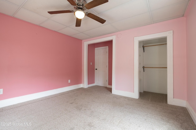 185 Bay St, Glens Falls, NY 12801 - unfurnished bedroom featuring a paneled ceiling, carpet flooring, baseboards, a ceiling fan, and a closet