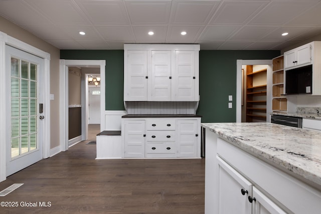 185 Bay St, Glens Falls, NY 12801 - kitchen with recessed lighting, open shelves, white cabinets, dark wood-style floors, and light stone countertops