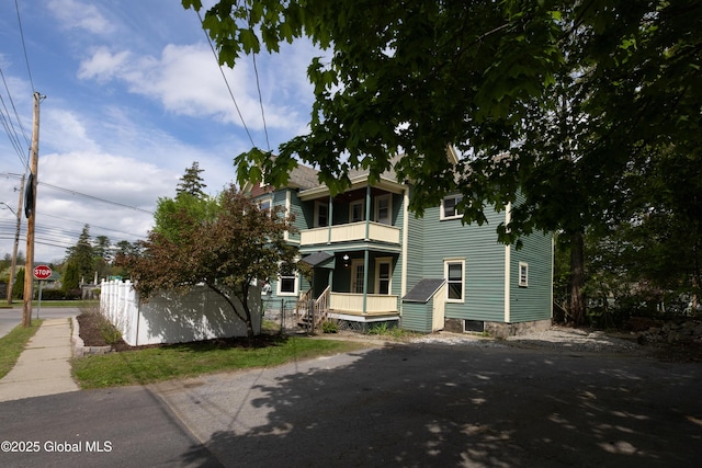 185 Bay St, Glens Falls, NY 12801 - rear view of property featuring a balcony and covered porch