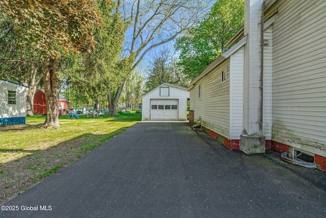 22 Center St, Fort Edward, NY 12828 - detached garage featuring asphalt driveway