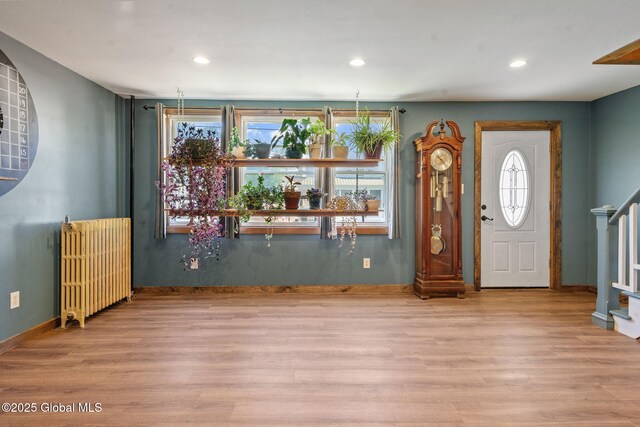 22 Center St, Fort Edward, NY 12828 - foyer entrance featuring radiator, wood finished floors, recessed lighting, stairs, and baseboards