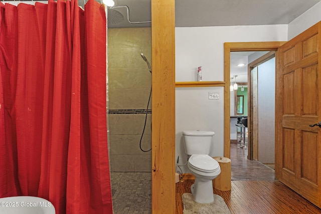 22 Center St, Fort Edward, NY 12828 - full bathroom with toilet, tiled shower, and wood finished floors