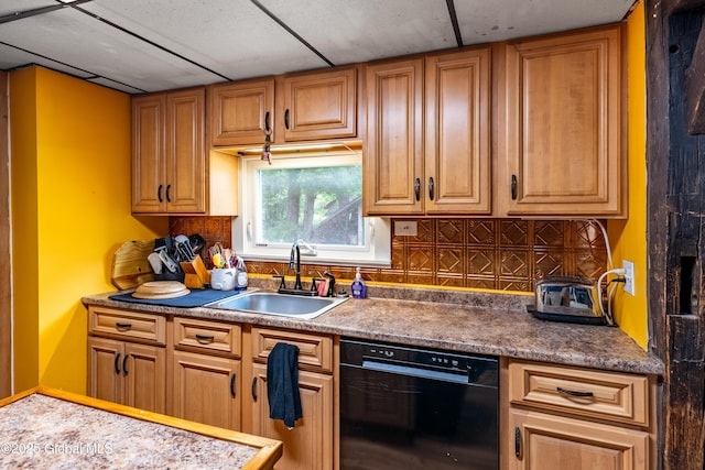 kitchen featuring black dishwasher, a sink, decorative backsplash, and brown cabinets