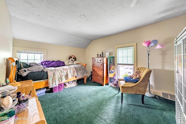 carpeted bedroom with lofted ceiling and baseboards
