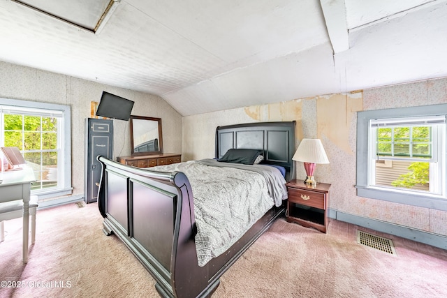 bedroom with light colored carpet, multiple windows, wallpapered walls, and vaulted ceiling