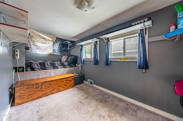 bedroom with carpet flooring and baseboards