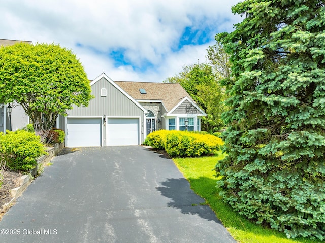 36 Greystone Dr, Guilderland, NY 12186 - view of front of property with driveway, an attached garage, and board and batten siding