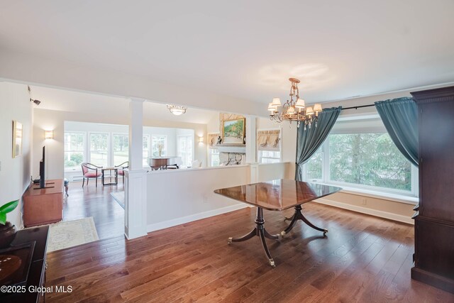 36 Greystone Dr, Guilderland, NY 12186 - dining space featuring healthy amount of natural light, a chandelier, and wood finished floors