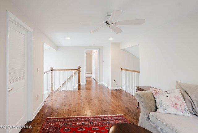 36 Greystone Dr, Guilderland, NY 12186 - hall with an upstairs landing, wood finished floors, baseboards, and recessed lighting