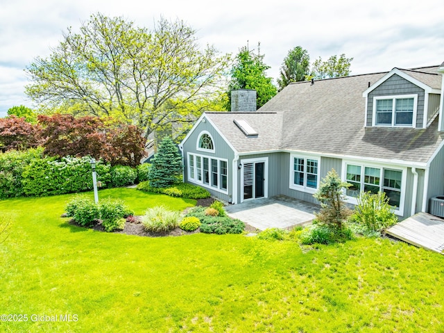 36 Greystone Dr, Guilderland, NY 12186 - rear view of house with a chimney, a patio, a lawn, cooling unit, and roof with shingles