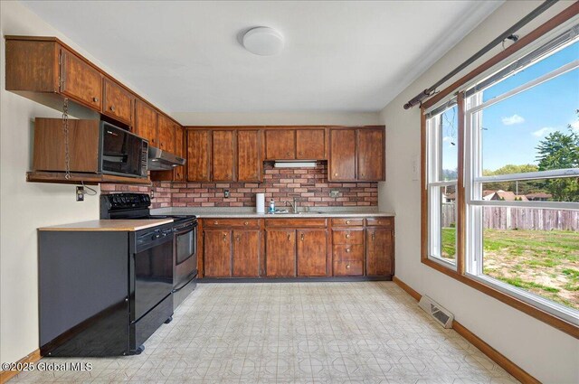 60 Edmund Dr, Milton, NY 12020 - kitchen featuring a sink, black appliances, light countertops, extractor fan, and baseboards