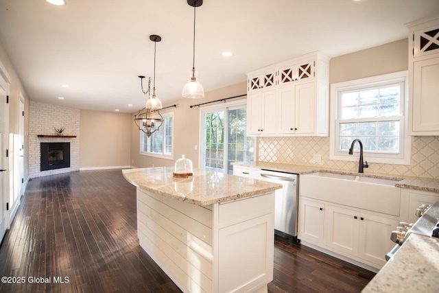 18 Alva St, East Greenbush, NY 12061 - kitchen featuring dishwasher, a kitchen island, dark wood-type flooring, decorative backsplash, and open floor plan