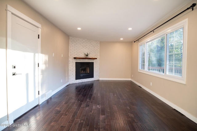 18 Alva St, East Greenbush, NY 12061 - unfurnished living room featuring dark wood-type flooring, a fireplace, baseboards, and recessed lighting