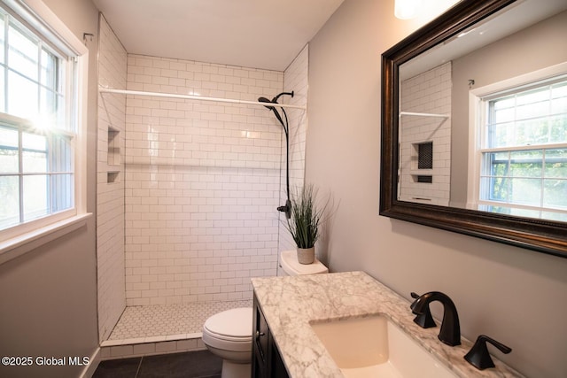 18 Alva St, East Greenbush, NY 12061 - full bath with a tile shower, toilet, vanity, and tile patterned floors