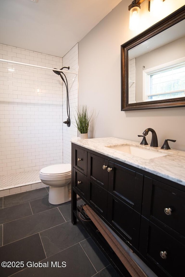 18 Alva St, East Greenbush, NY 12061 - full bath featuring tiled shower, toilet, vanity, and tile patterned floors