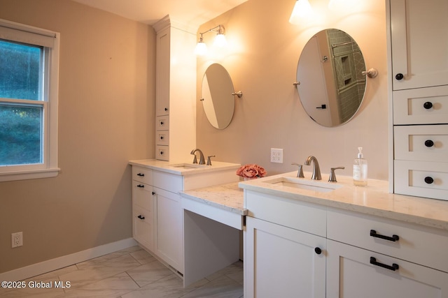 18 Alva St, East Greenbush, NY 12061 - full bathroom with marble look tile flooring, vanity, and baseboards