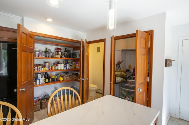 dining space featuring a baseboard heating unit