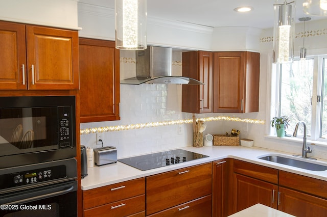 kitchen featuring black appliances, wall chimney exhaust hood, a sink, backsplash, and ornamental molding
