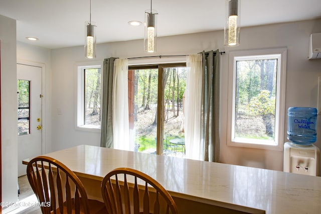 dining room featuring healthy amount of natural light and recessed lighting