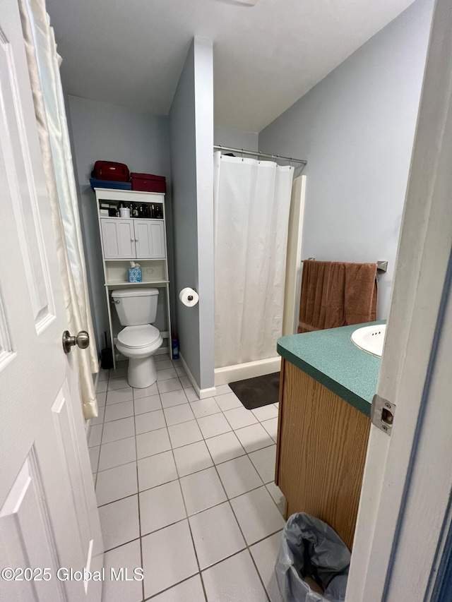 25 Hilton Dr, Moreau, NY 12803 - bathroom with tile patterned flooring, toilet, vanity, and a shower with curtain