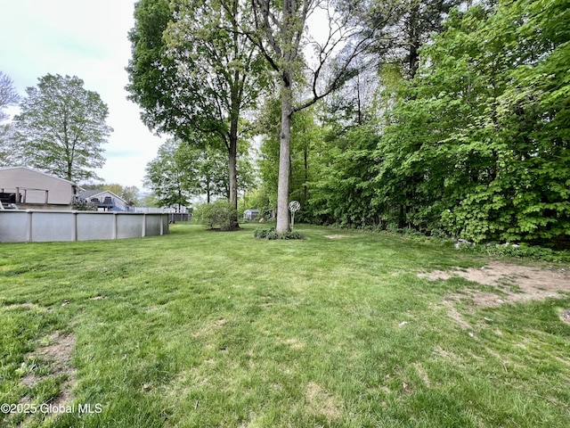 25 Hilton Dr, Moreau, NY 12803 - view of green lawn featuring an outdoor pool