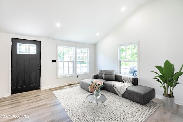 15 Schaffer Dr, Colonie, NY 12047 - living area with plenty of natural light, light wood finished floors, recessed lighting, baseboards, and high vaulted ceiling