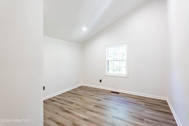 15 Schaffer Dr, Colonie, NY 12047 - unfurnished room with vaulted ceiling, wood finished floors, baseboards, and recessed lighting