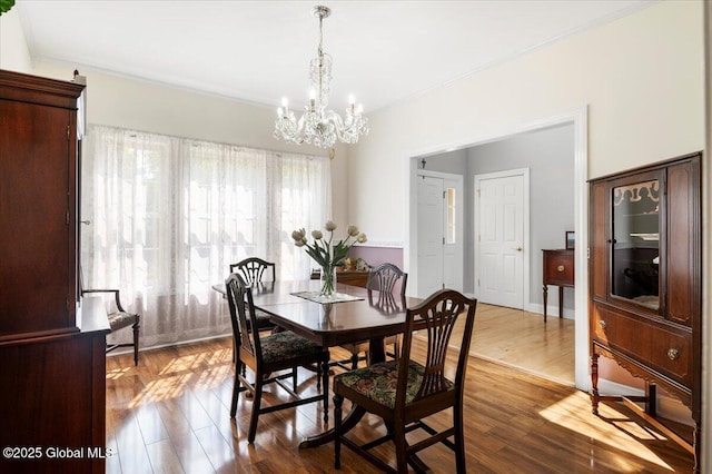 264 Edie Rd, Wilton, NY 12866 - dining area featuring a chandelier, crown molding, and dark wood-type flooring