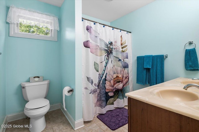 264 Edie Rd, Wilton, NY 12866 - full bath with toilet, baseboards, vanity, tile patterned floors, and curtained shower