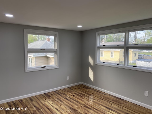 2112 Gray St, Rotterdam, NY 12306 - unfurnished room featuring wood finished floors, plenty of natural light, baseboards, and recessed lighting