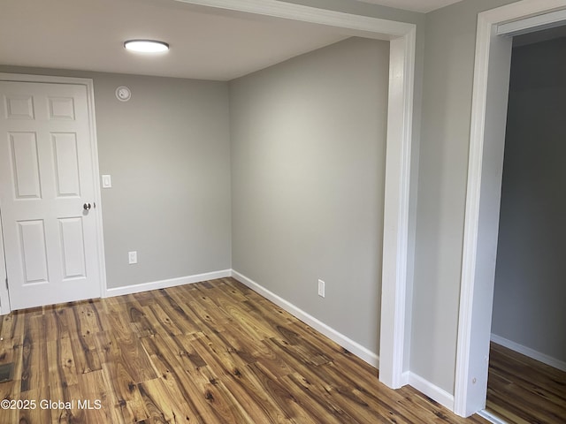 2112 Gray St, Rotterdam, NY 12306 - unfurnished room with baseboards, dark wood-type flooring, and a smoke detector
