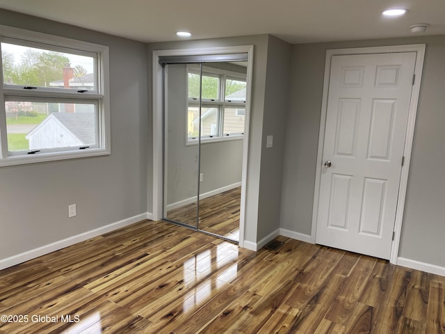 2112 Gray St, Rotterdam, NY 12306 - unfurnished bedroom with wood finished floors, a closet, recessed lighting, and baseboards