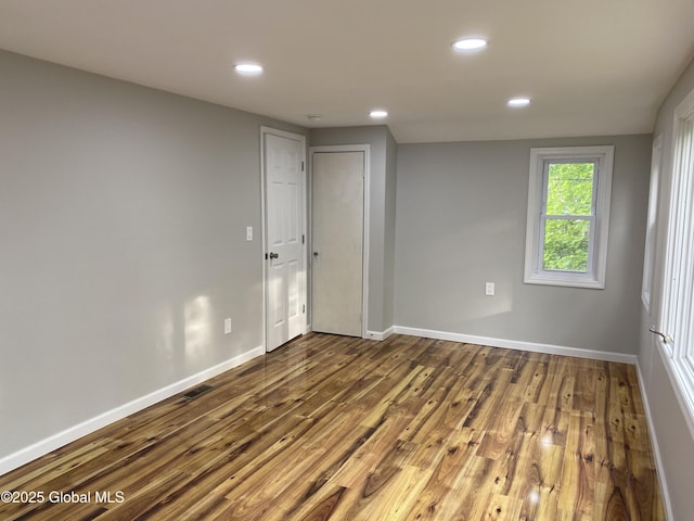 2112 Gray St, Rotterdam, NY 12306 - spare room featuring dark wood-type flooring, recessed lighting, and baseboards