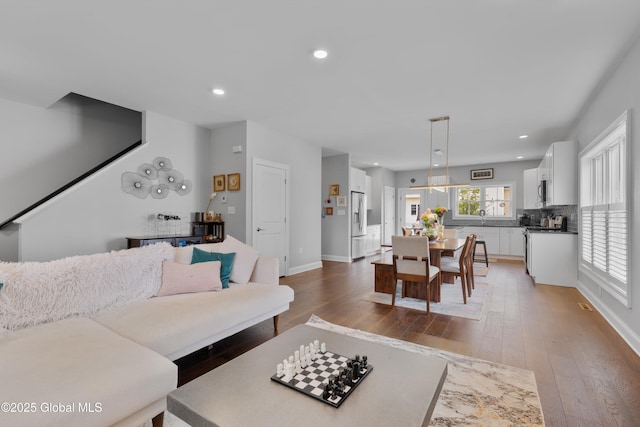 305 W Circular St, Saratoga, NY 12866 - living area featuring wood-type flooring and recessed lighting