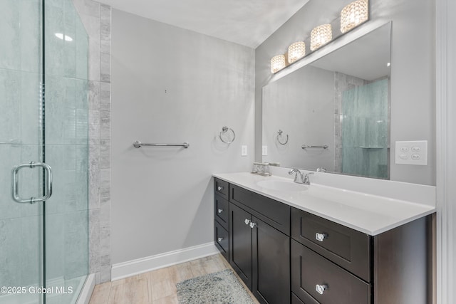 305 W Circular St, Saratoga, NY 12866 - bathroom featuring vanity, a stall shower, and wood finished floors