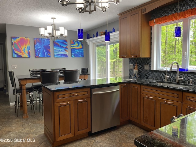 6 Bishops Ct, Queensbury, NY 12804 - kitchen with a chandelier, a sink, dishwasher, a peninsula, and backsplash