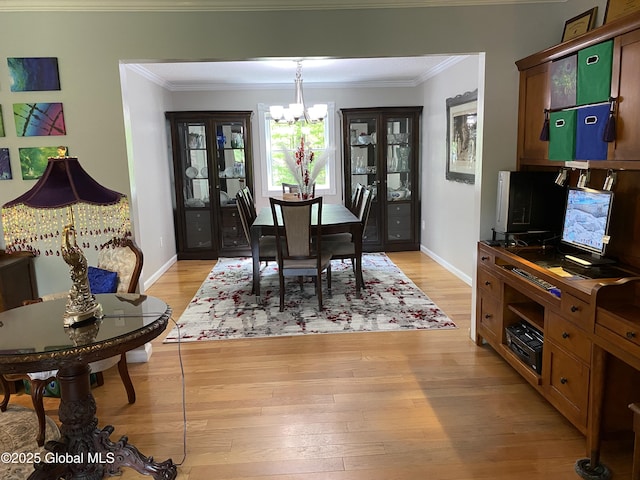 6 Bishops Ct, Queensbury, NY 12804 - dining room with a chandelier, crown molding, light wood-type flooring, and baseboards