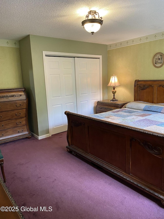 6 Bishops Ct, Queensbury, NY 12804 - bedroom with a closet, dark carpet, and a textured ceiling