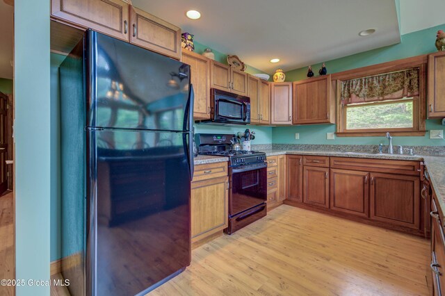 324 County Highway 112, Bleecker, NY 12078 - kitchen featuring black appliances, a sink, light wood-type flooring, brown cabinets, and recessed lighting