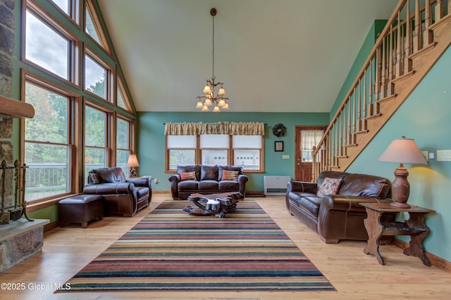 324 County Highway 112, Bleecker, NY 12078 - living room with high vaulted ceiling, a chandelier, plenty of natural light, stairway, and baseboards